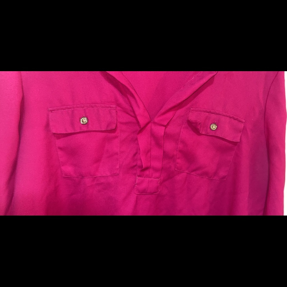A hot pink blouse